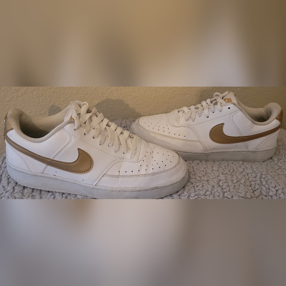 Nike White Sneakers with Gold Swoosh Accent